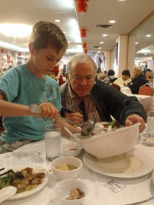 Grandpa Bill helps  Emerson with more wonton soup